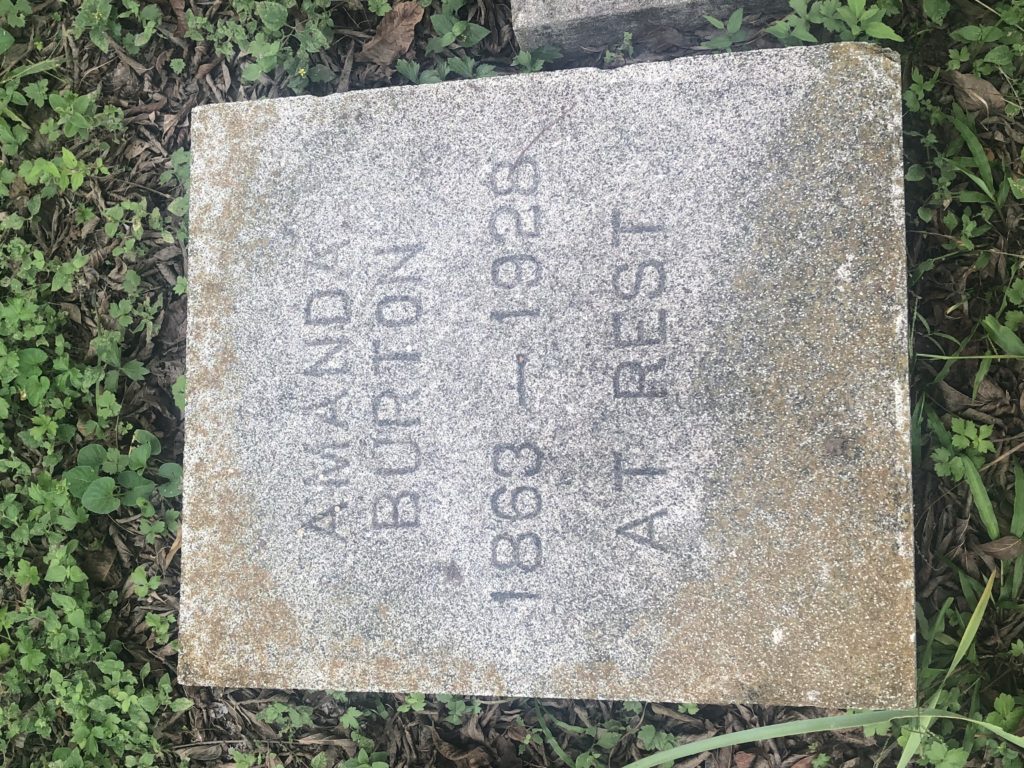 Almost square-shaped headstone that reads "Amanda Burton; 1863-1928; at rest."